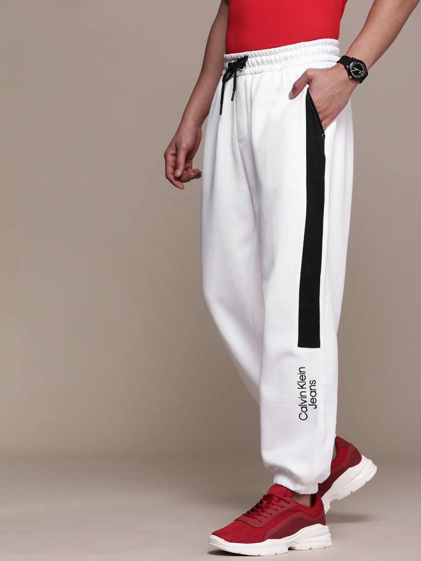 Buy Calvin Klein Jeans White Brand Logo Printed Mid Rise Joggers With Constrast Side Stripes Track Pants for Men 19533278 Myntra