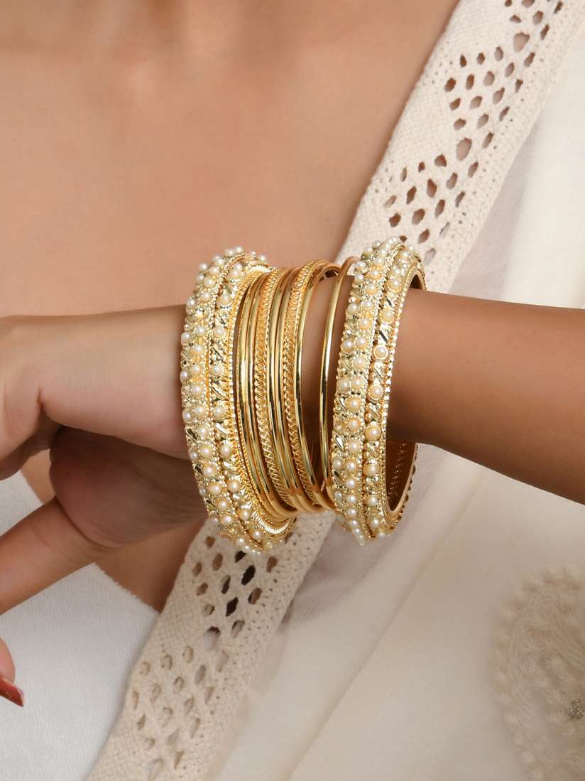 White stone studded gold bangles hot sale
