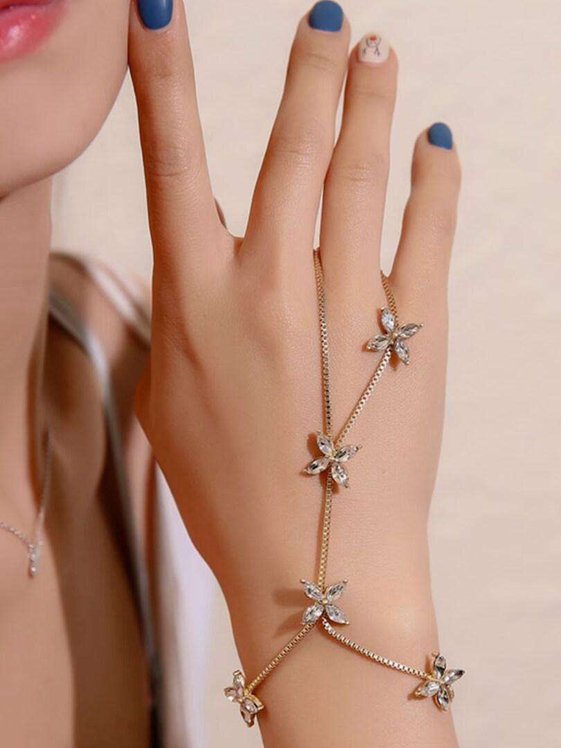 Gold hand bracelet with ring on sale