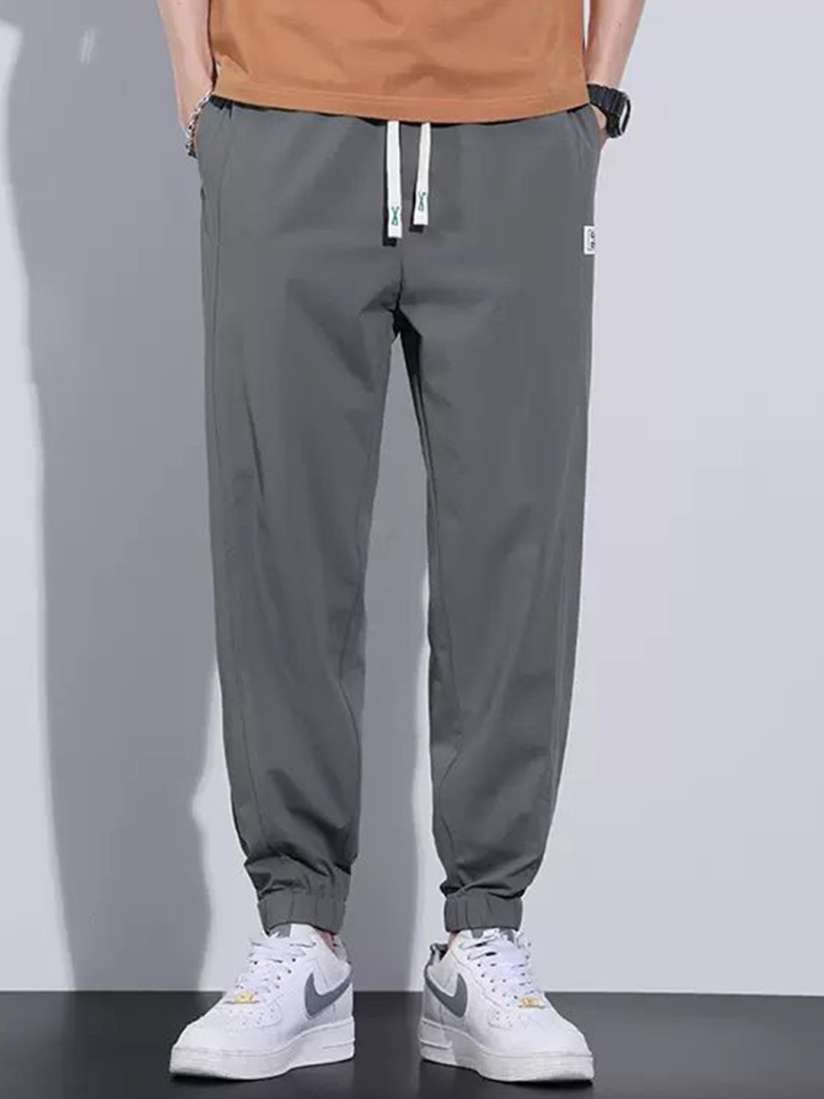 Buy StyleCast Men Mid Rise Joggers 3000191 Grey Track Pants for Men 30501730 Myntra
