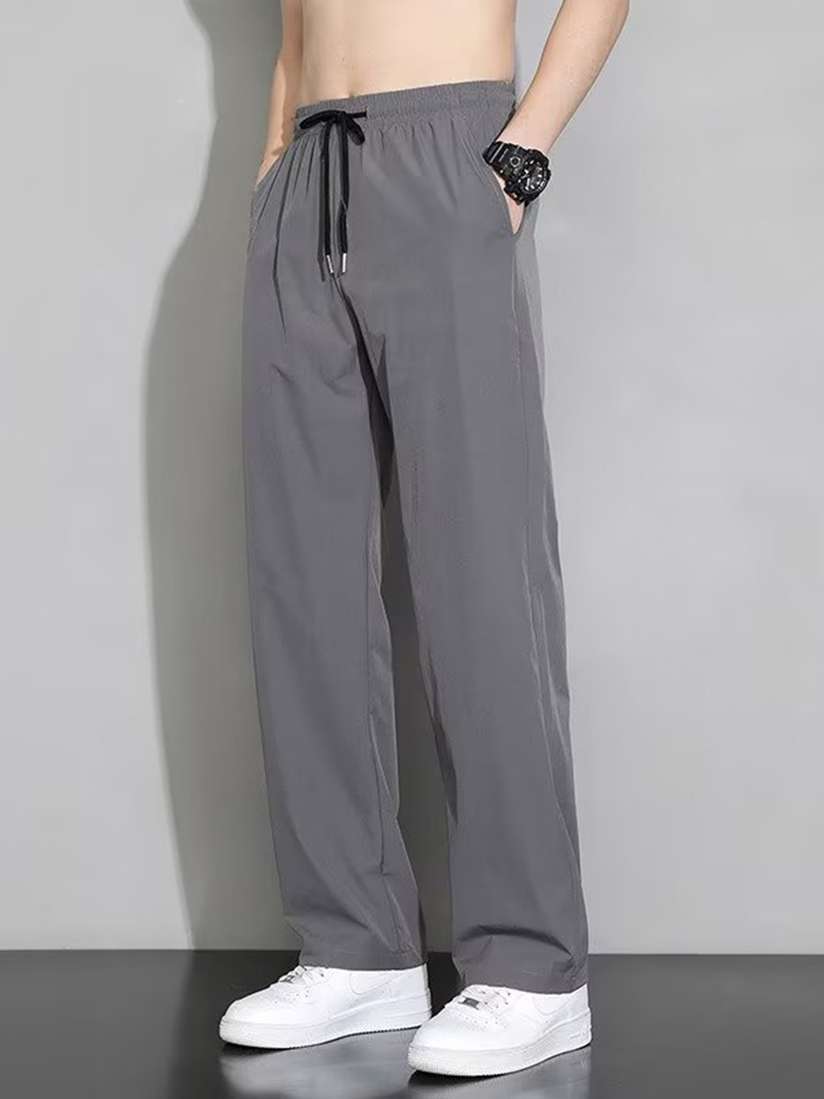 Buy StyleCast Men Solid Loose Fit Wide Leg Trousers - Trousers for Men  30926370 | Myntra