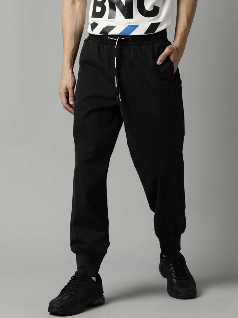 Buy Breakbounce Men Black Solid Loose Fit Cotton Joggers Trousers for Men 20473072 Myntra