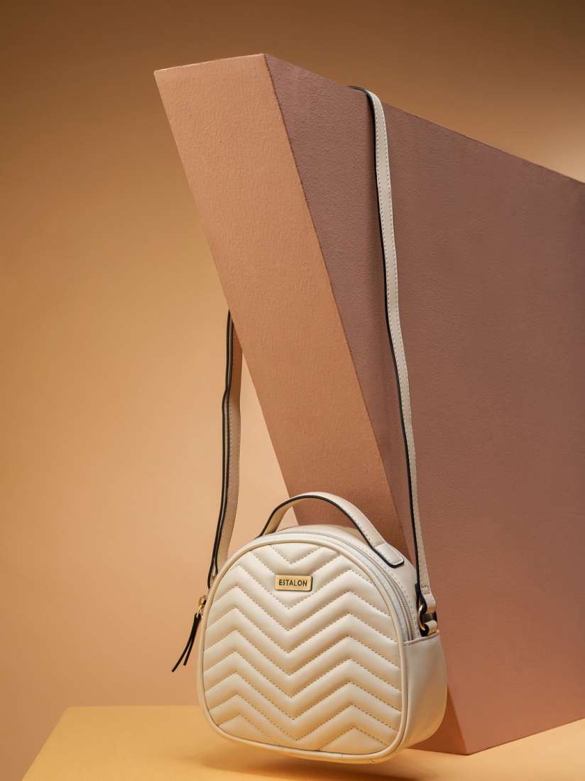 Buy ESTALON Beige PU Structured Round Sling Bag with Chevron Quilted Handbags for Women 20686590 Myntra
