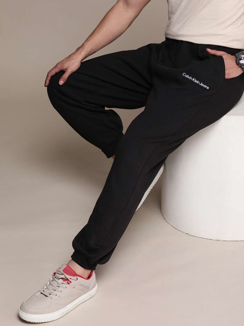 Buy Calvin Klein Jeans Men Brand Logo Embroidered Mid Rise Joggers Track Pants for Men 21085558 Myntra