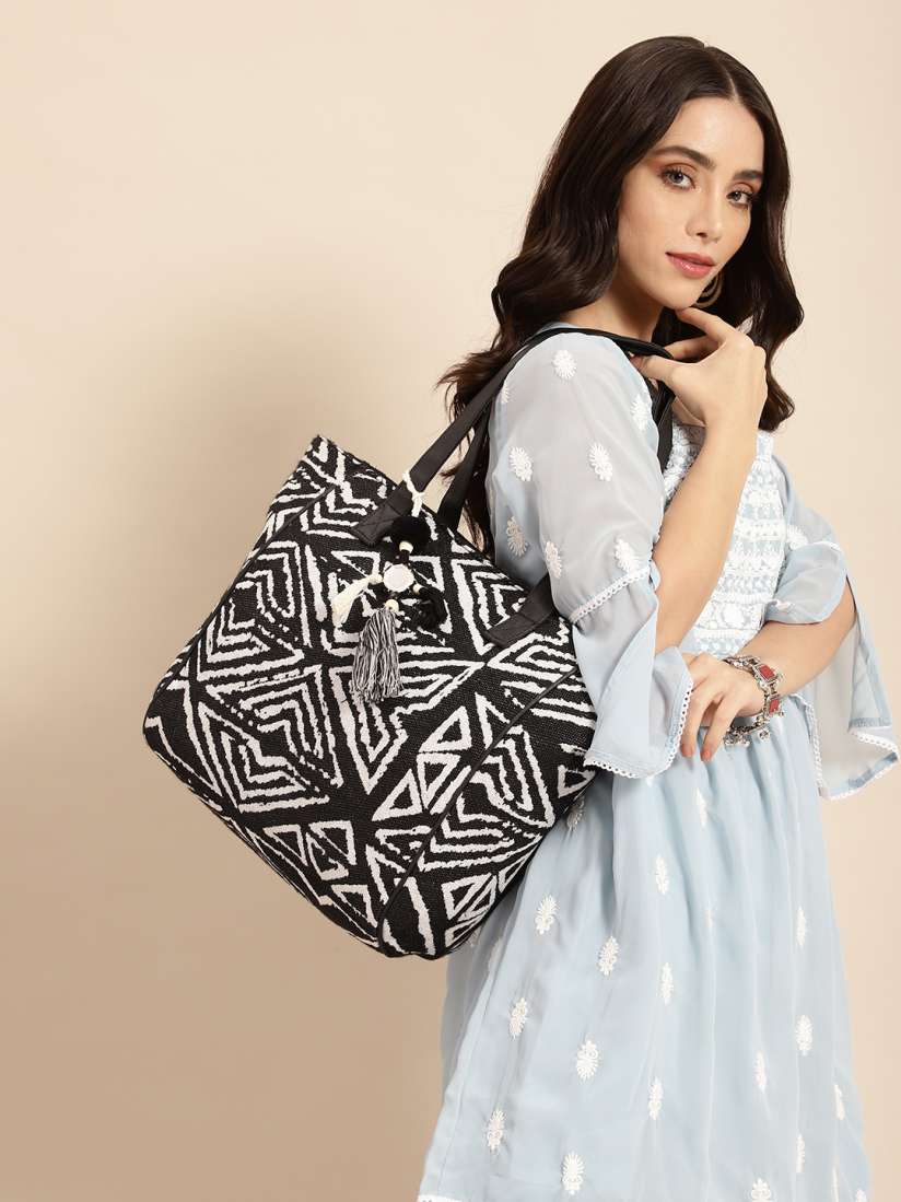 Buy Anouk Geometric Design Structured Shoulder Bag with Tasselled Detail Handbags for Women 21866190 Myntra