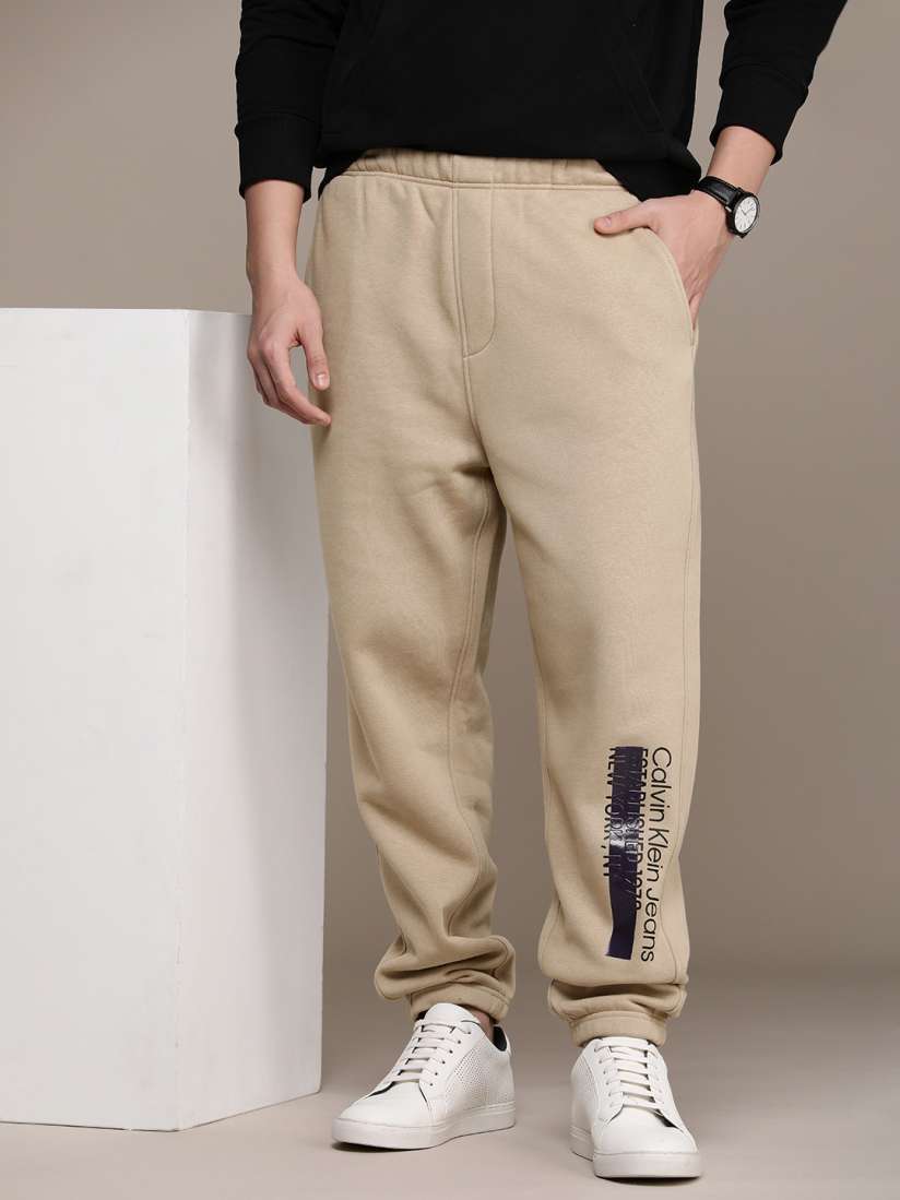 Buy Calvin Klein Jeans Men Brand Logo printed Mid Rise Relaxed Fit Joggers Track Pants Track Pants for Men 23710568 Myntra