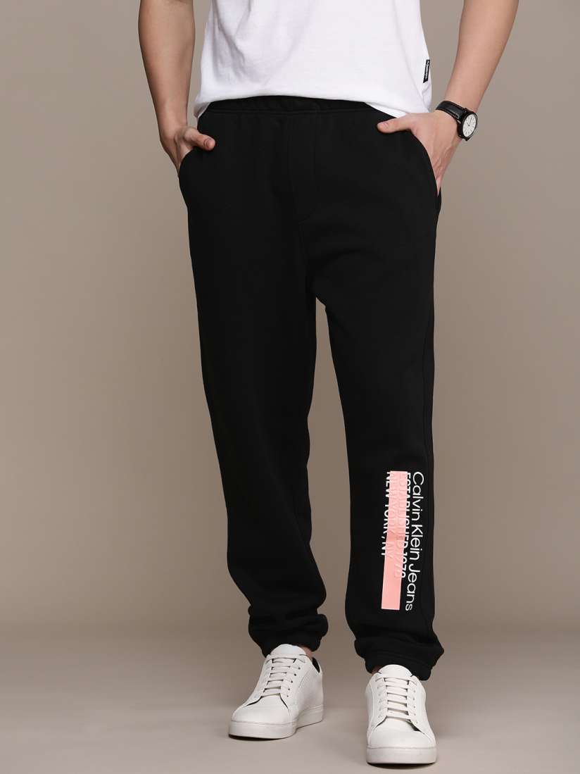 Buy Calvin Klein Jeans Men Brand Logo printed Mid Rise Relaxed Fit Joggers Track Pants Track Pants for Men 23710590 Myntra