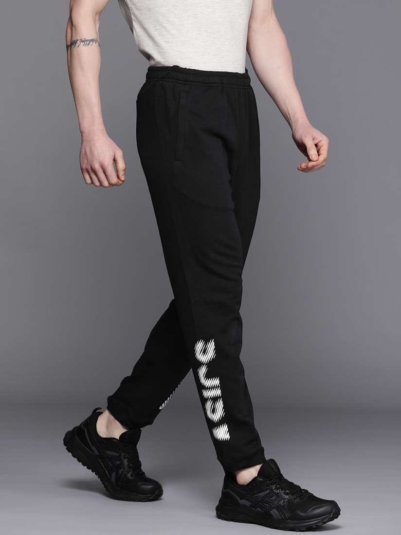 Asics black joggers sales