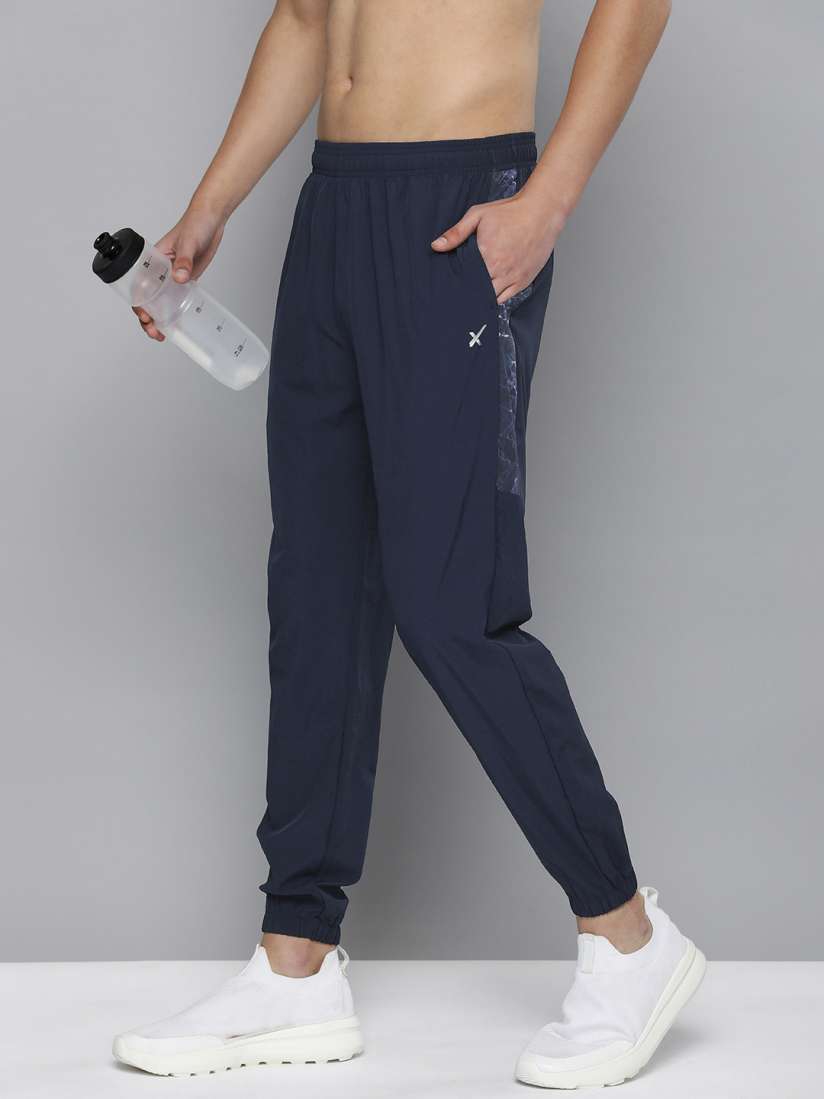 Buy HRX by Hrithik Roshan Men Solid Rapid Dry Running Track Pants With Side Prints Track Pants for Men 23881580 Myntra