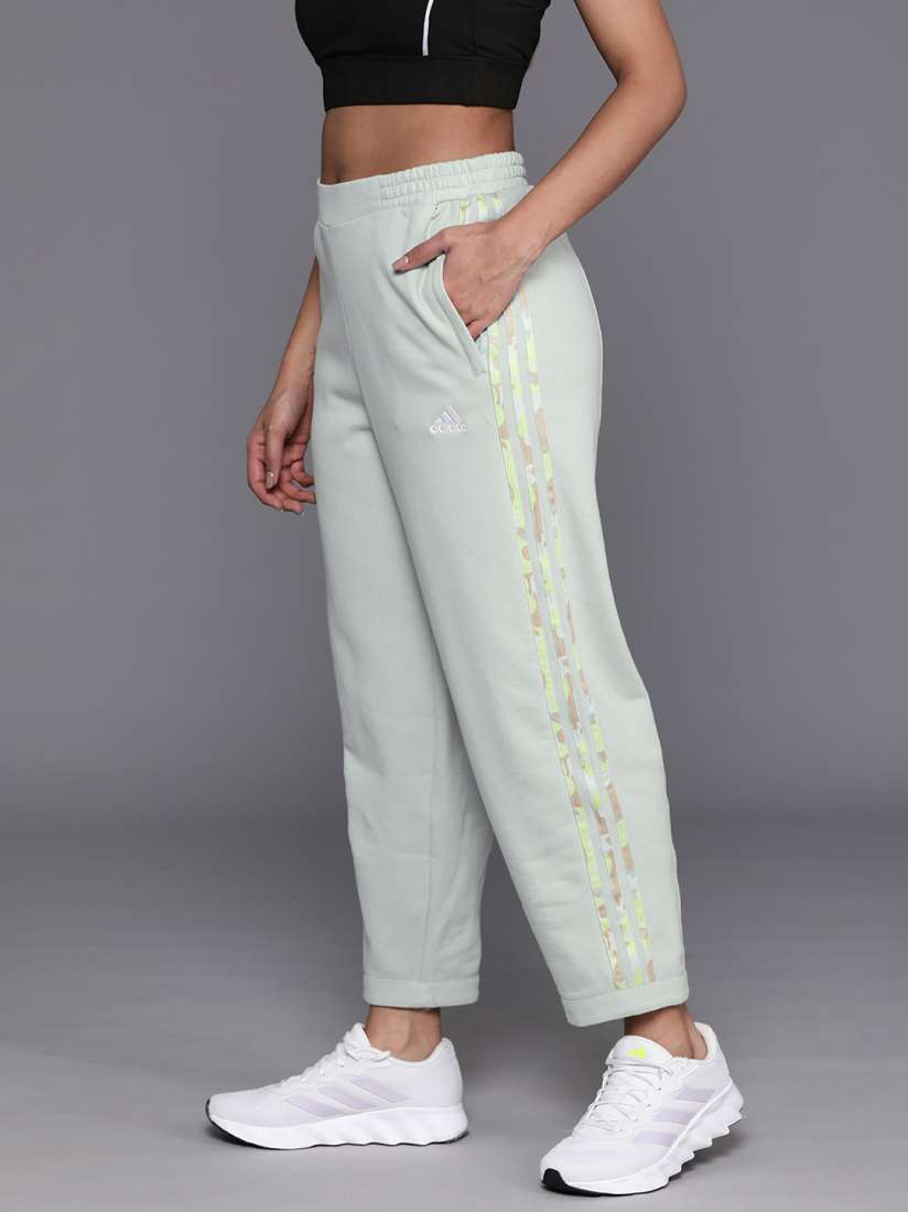 White adidas pants with gold stripes top