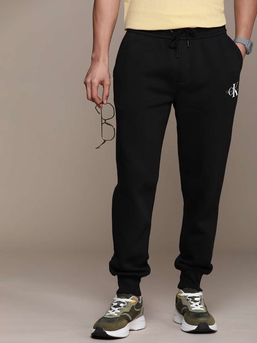 Buy Calvin Klein Jeans Men Solid Mid Rise Regular Fit Joggers Track Pants for Men 26324720 Myntra