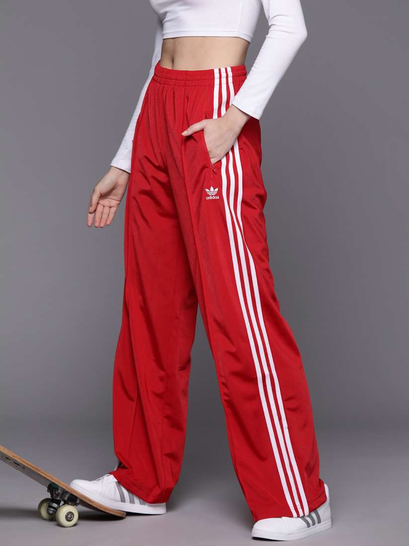 black adidas pants with red stripes