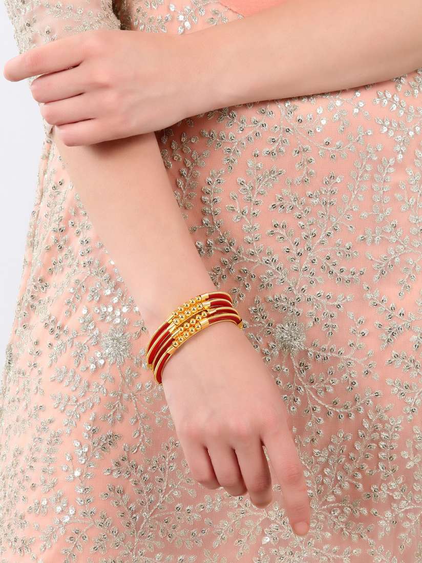 Red bangles with gold plated top