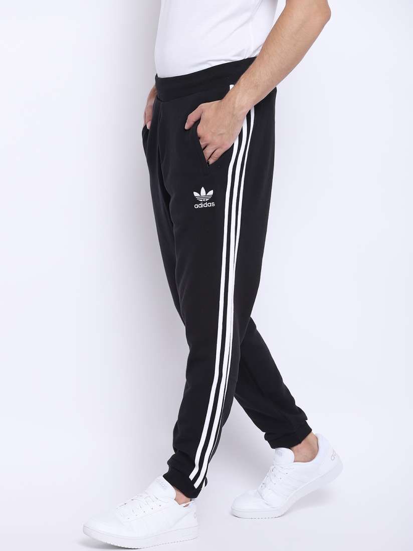White adidas joggers with black stripes on sale
