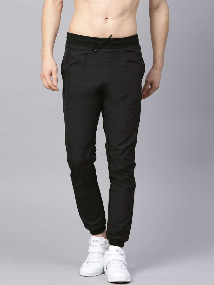 Buy HRX By Hrithik Roshan Men Black Solid Joggers Track Pants for Men 8424219 Myntra